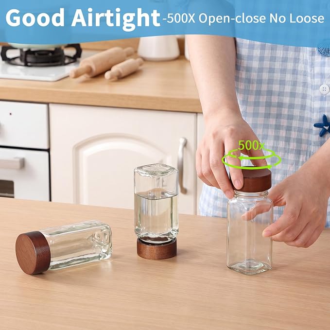 Yangbaga Glass Spice Containers for Kitchen: 24p 4oz Durable Glass Dishwasher Safe Jars w/2p Rack for Cooking Enthusiasts- Airtight Acacia lid 500X Open-Close no Loose - Gift/Daily Use for Housewives