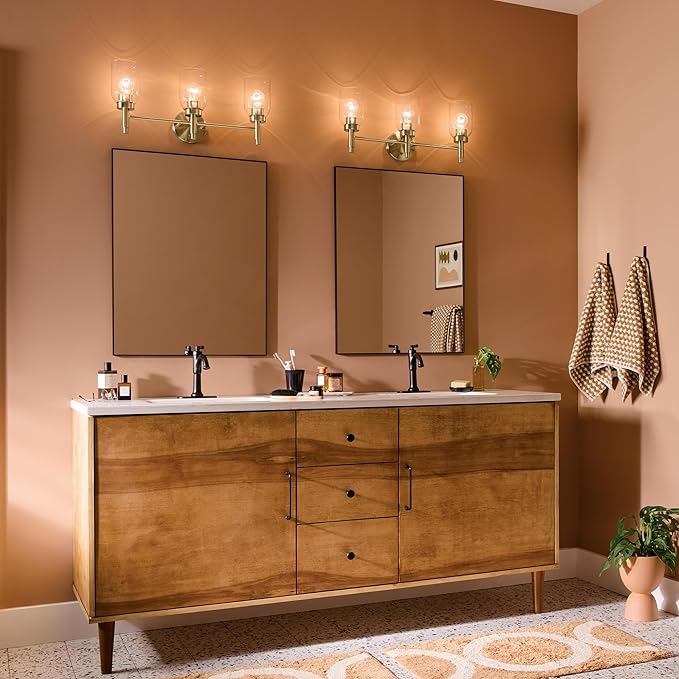Kichler Madden 3-Light Bathroom Vanity Light Fixture with Clear Glass in Champagne Bronze, Modern Wall Mount Lighting for Single Vanity Mirror (10.5" x 24"), 55185CPZ