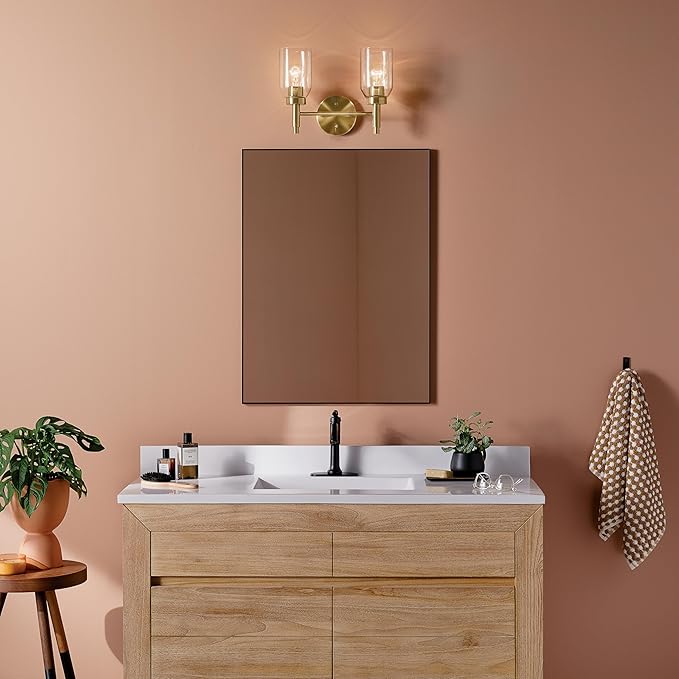 Kichler Madden 2-Light Bathroom Vanity Light Fixture with Clear Glass Shades, Modern Wall Mount Lighting in Champagne Bronze for Single or Double Vanity (10.5" x 14.25"), 55184CPZ